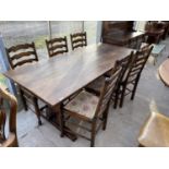 AN OAK REFECTORY DINING TABLE WITH PEGGED STRETCHER RAIL AND SIX LADDER BACK OAK DINING CHAIRS