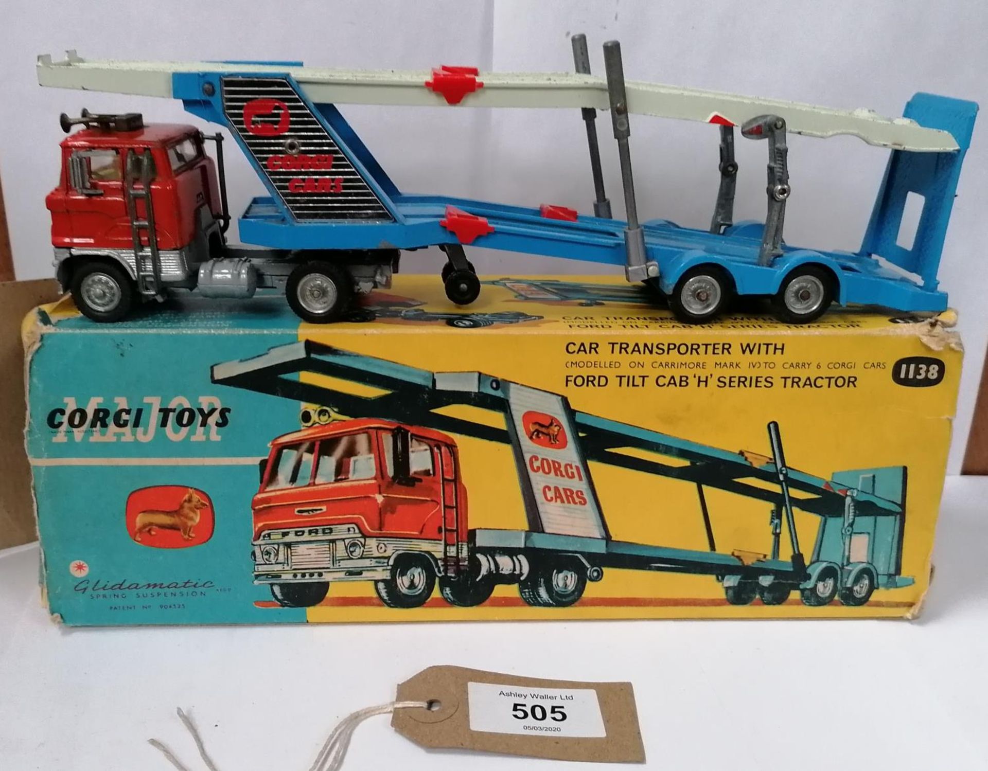 A CORGI MAJOR TOYS CAR TRANSPORTER WITH FORD TILT CAB 'H' SERIES TRACTOR IN ORIGINAL (BUT DAMAGED)