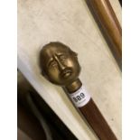 A FOUR FACED BUDDAH HANDLED WALKING STICK