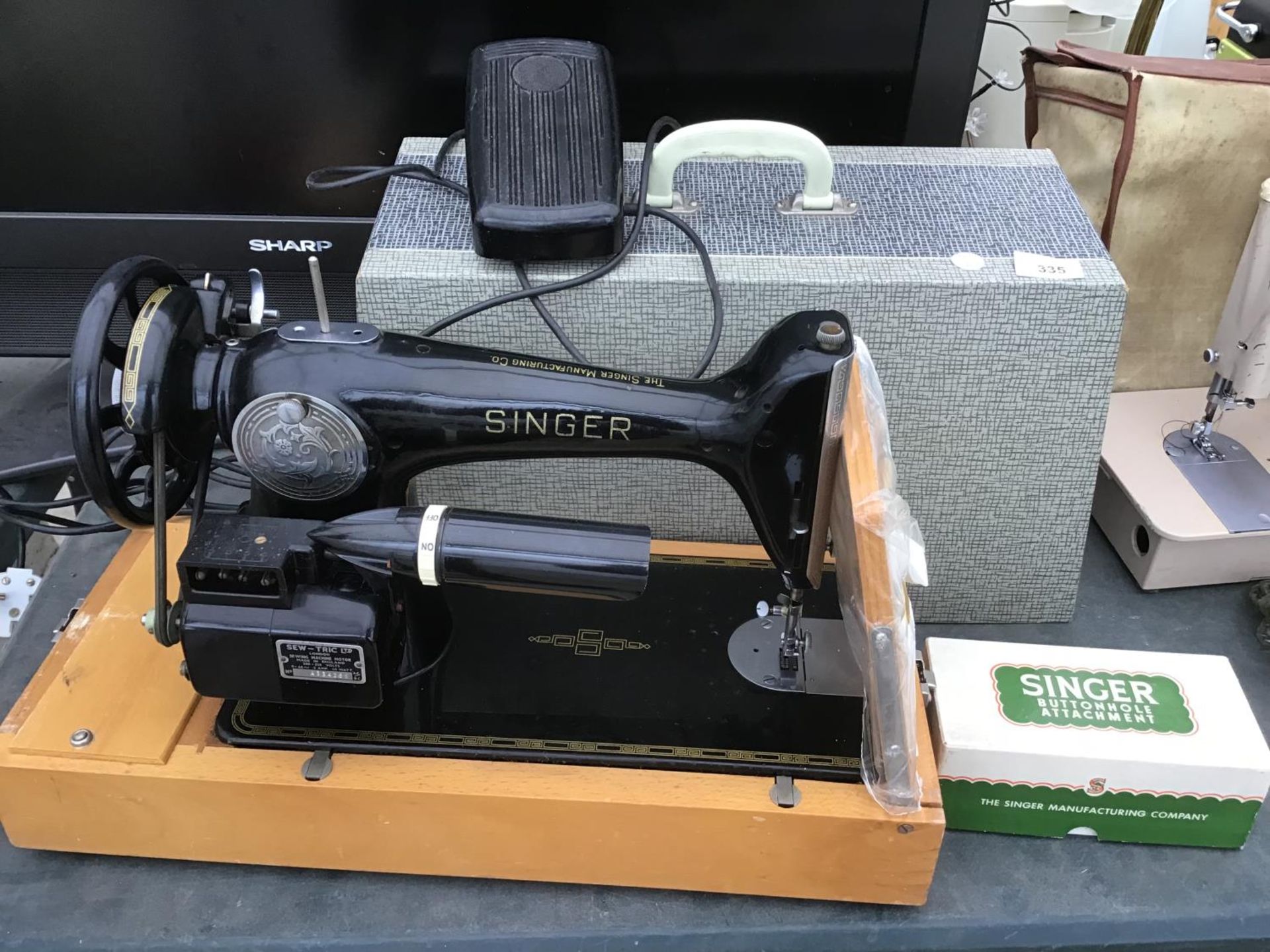 A VINTAGE SINGER SEWING MACHINE WITH CASE, PEDAL AND BUTTONHOLE ATTACHMENT