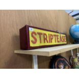 A 'STRIPTEASE' ILLUMINATED LIGHT BOX SIGN