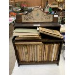 A WOODEN PETER RABBITS BOOK SHELF AND BOOKS