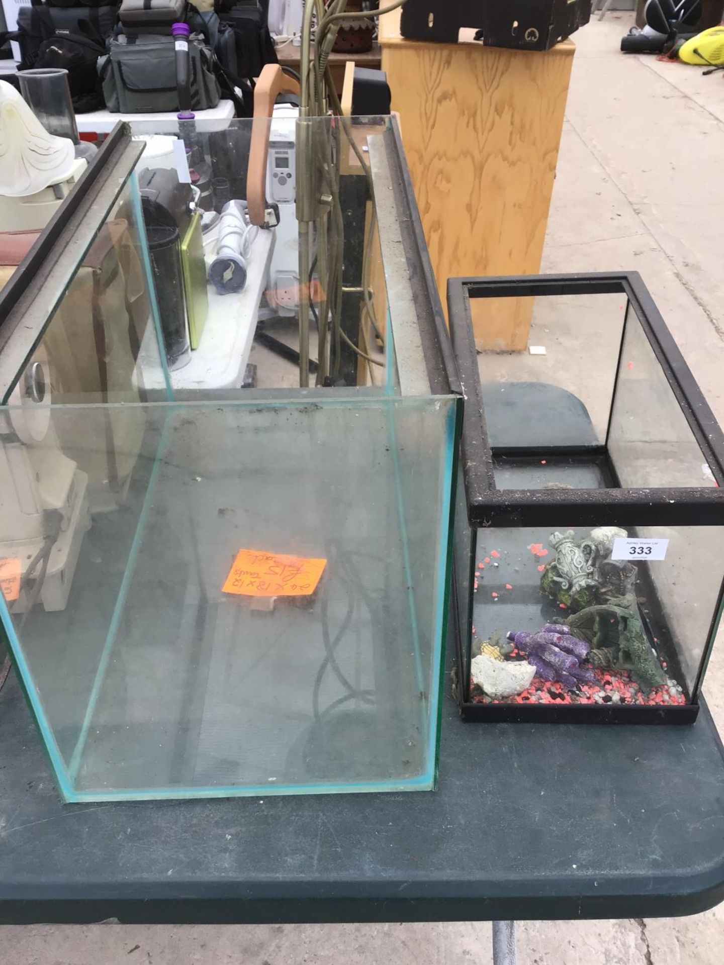 TWO GLASS TANKS (ONE A/F) AND ONE WITH ORNAMENTS