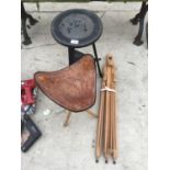 A LEATHER TOPPED THREE LEGGED FOLDING STOOL, AN EASEL AND A WOODEN CHINESE STYLE TABLE WITH LOWER