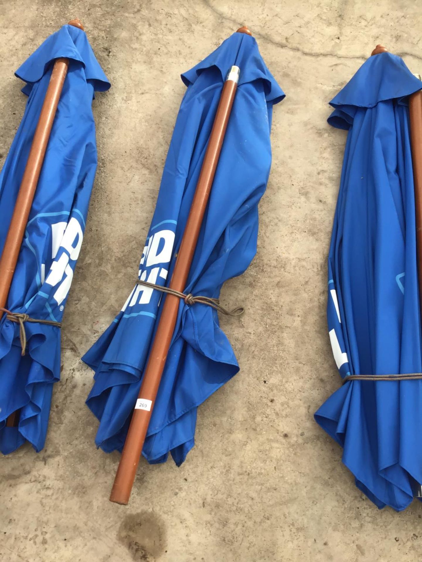 A WOODEN FRAMED BUD LIGHT PARASOL