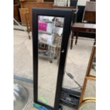 A MIRROR FRONTED TALL KEY/STORAGE CABINET WITH KEY