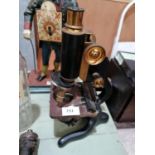 A VINTAGE STUDENT'S MICROSCOPE