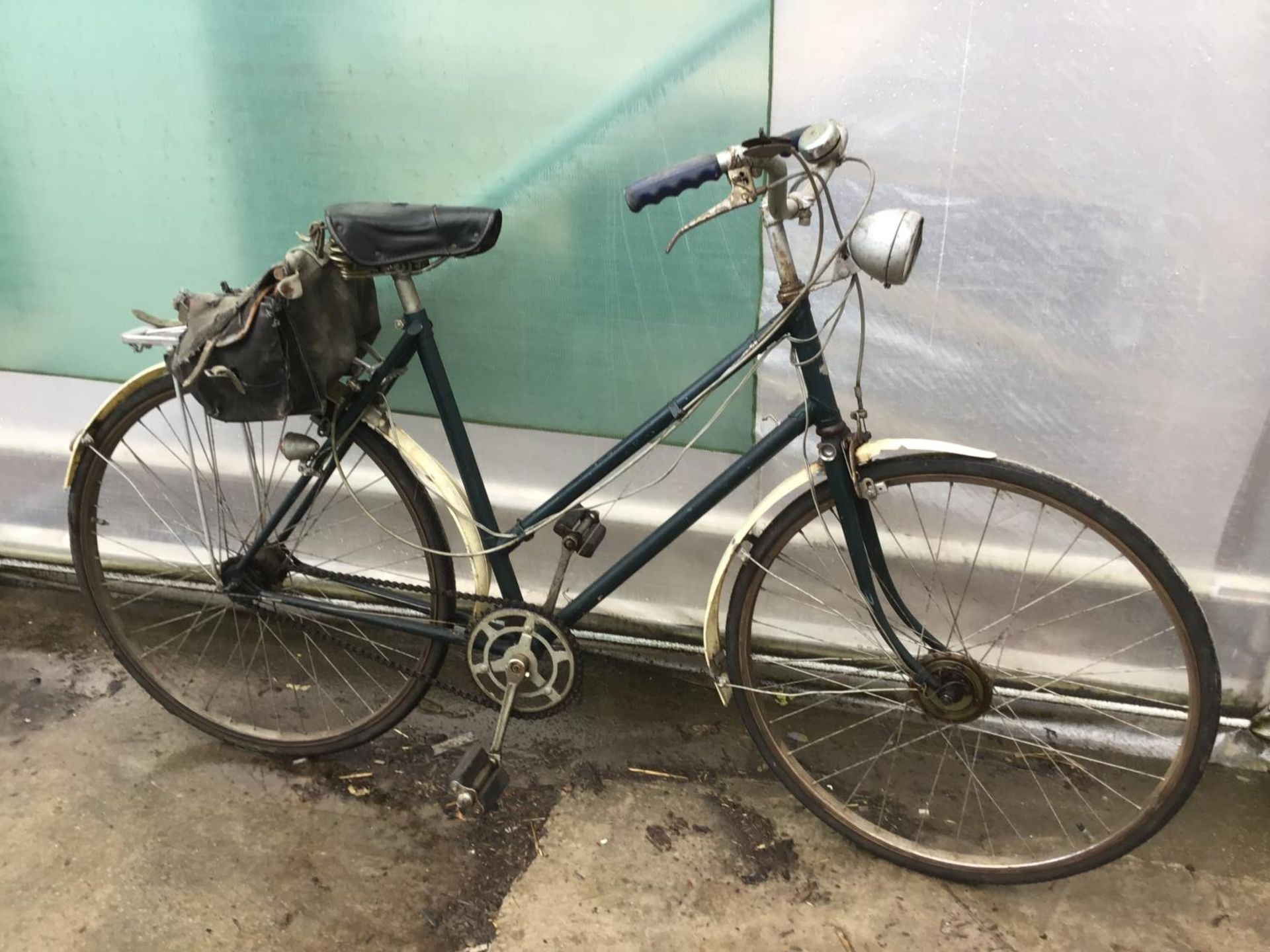 A VINTAGE BIKE WITH REAR PANNIER AND A THREE GEAR STURMEY ARCHER SYSTEM