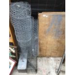 TWO METAL VERMIN TRAPS, CHICKEN WIRE AND A WOODEN PASTING TABLE