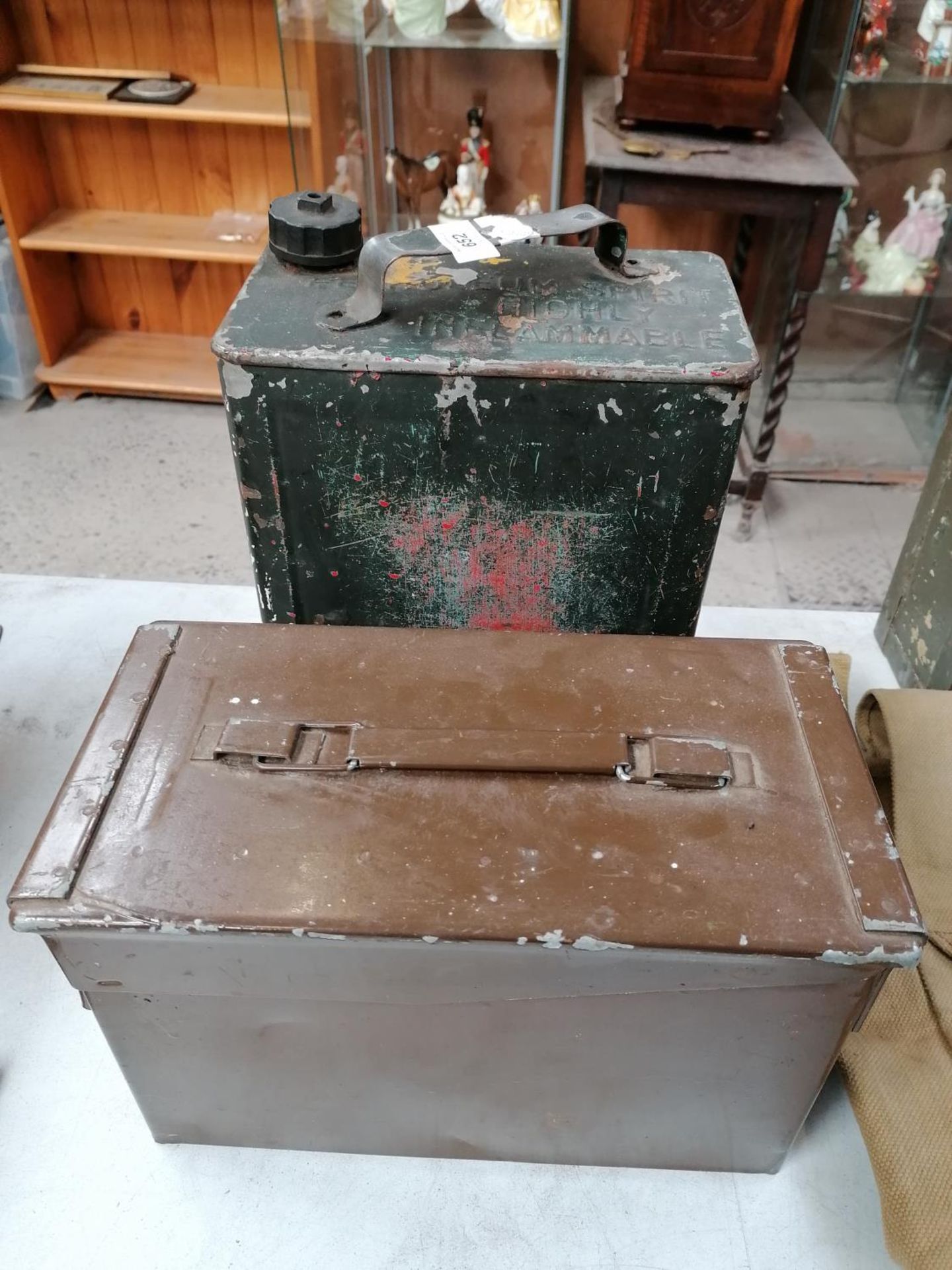 A 1200 X 9MM AMMO BOX AND PETROL CAN