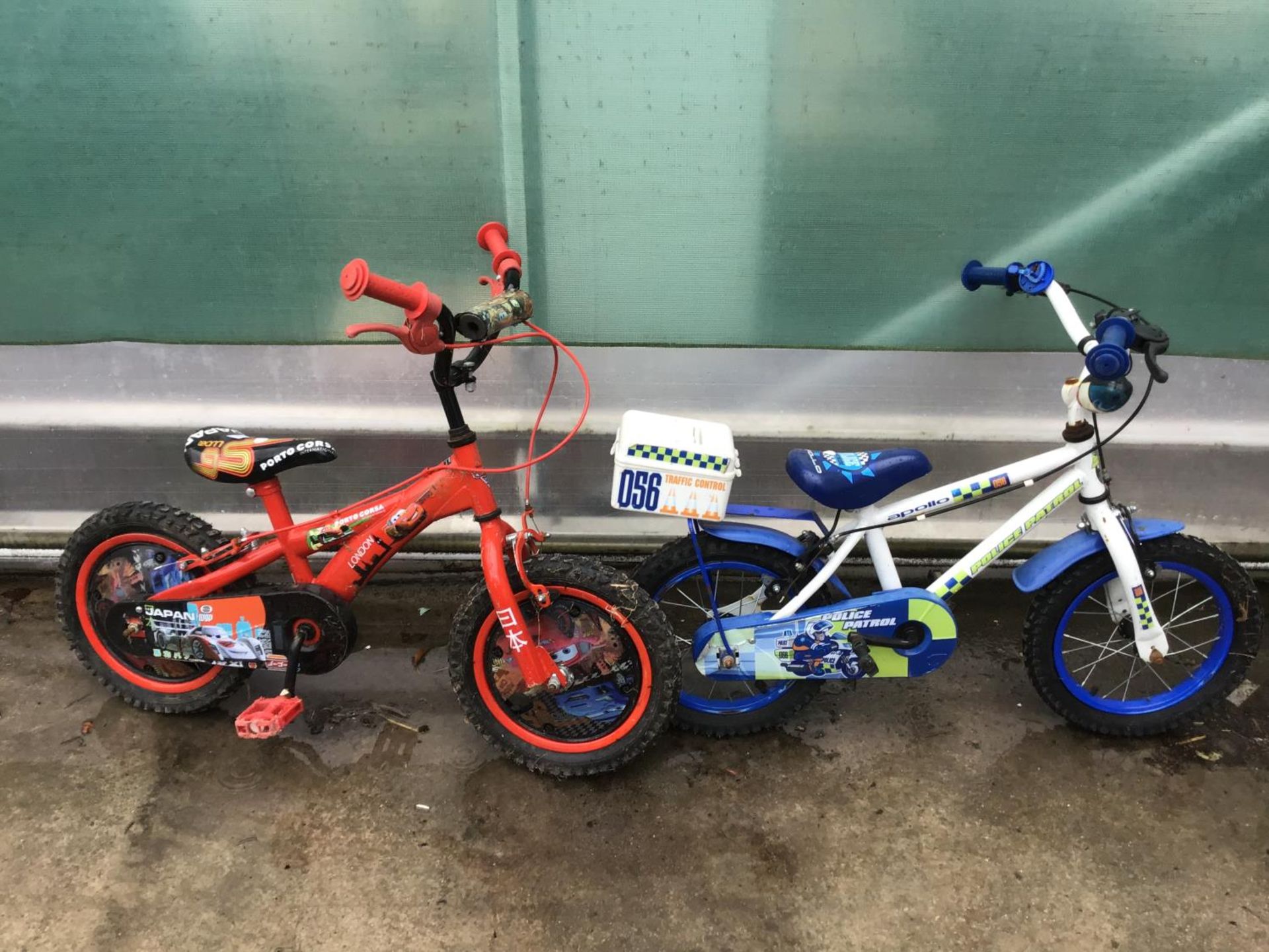 TWO CHILDREN'S BIKES TO INCLUDE A LIGHTENING MCQUEEN AND POLICE