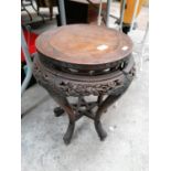 A CHINESE CARVED WOODEN JARDINIERE STAND WITH STAR OF DAVID SHELF DESIGN