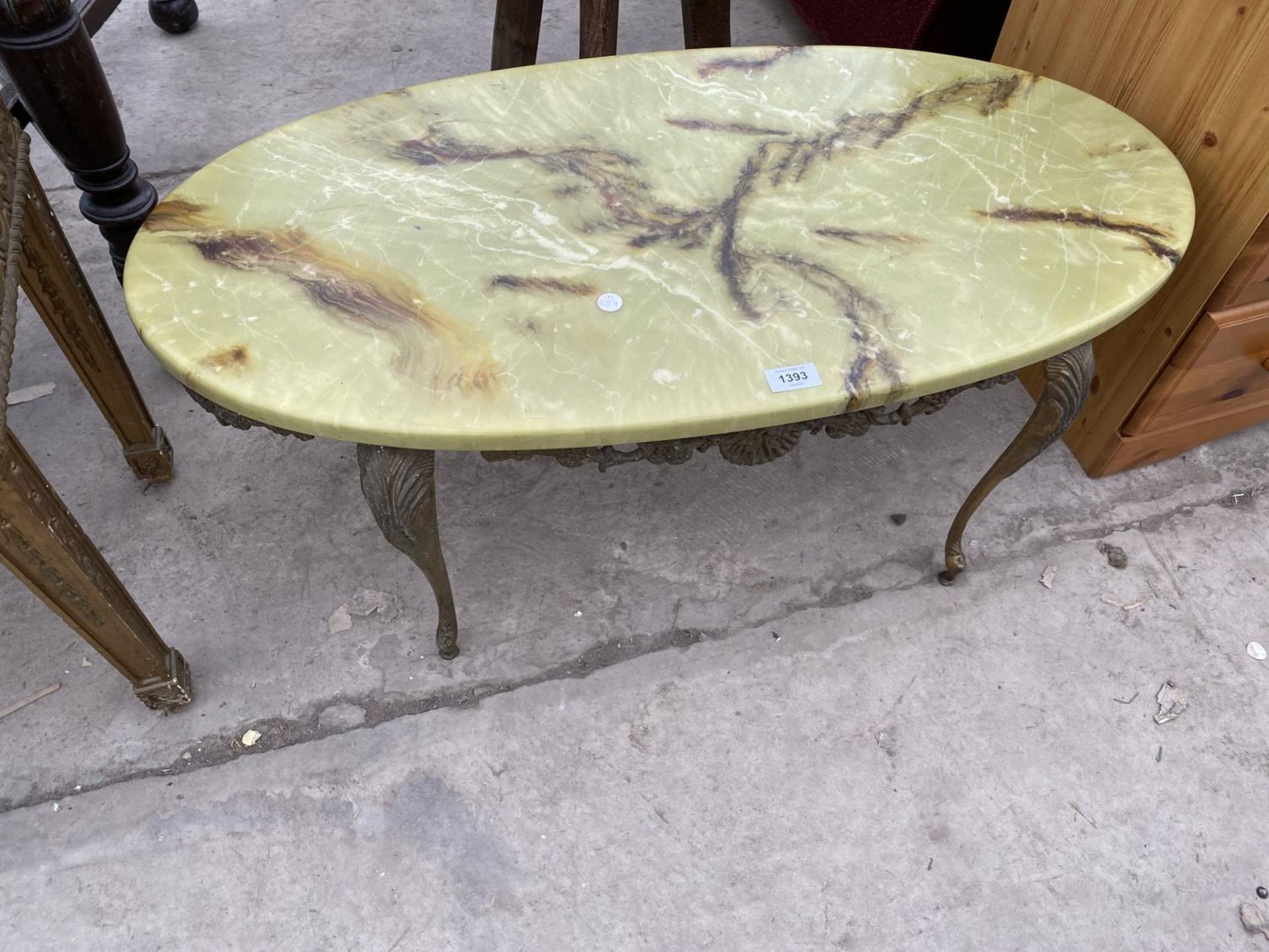 AN ONYX AND BRASS COFFEE TABLE