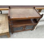 AN OLD CHARM OAK TEA TROLLEY