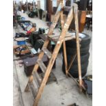 A SET OF VINTAGE FOUR STEP WOODEN STEP LADDERS AND A WOODEN PLANT STAND