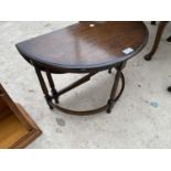 AN UNUSUAL CIRCULAR OAK DROP LEAF OCCASIONAL TABLE