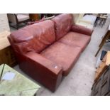 A BROWN LEATHER TWO SEATER SOFA