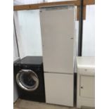 AN UPRIGHT FRIDGE FREEZER IN WORKING ORDER