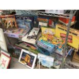 A LARGE COLLECTION OF GAMES AND JIGSAWS TO INCLUDE CONNECT 4, HUNGRY TROLL, DOUBLE CROSS, RACE