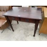 A MAHOGANY SIDE TABLE ON TURNED SUPPORTS WITH TWO DRAWERS