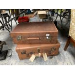 TWO VINTAGE SUITCASES WITH VINTAGE AIRPORT AND TRAVEL TAGS