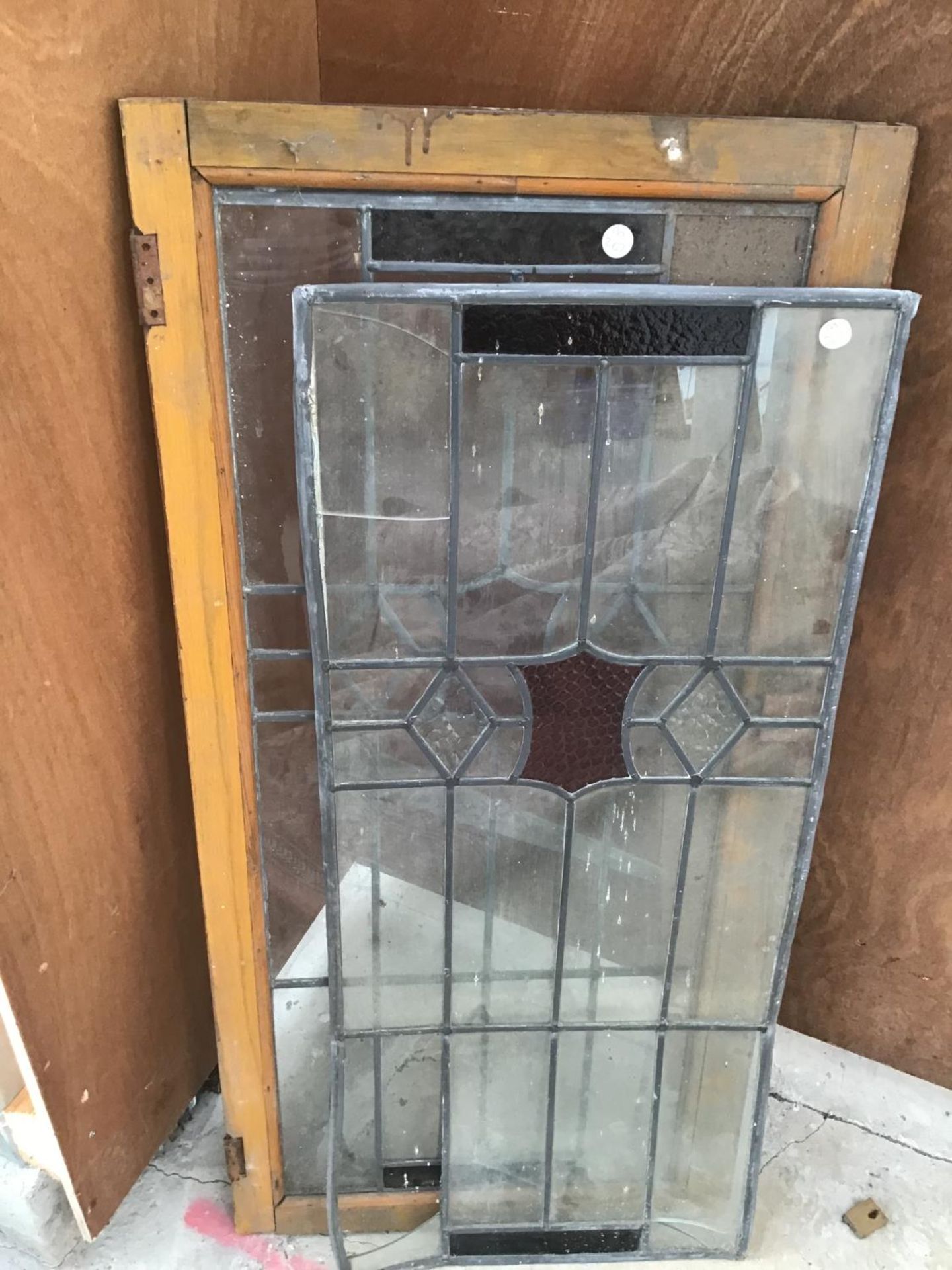 A PAIR OF LEADED GLASS PANELS (A/F)