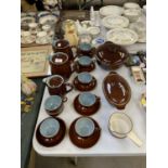 A DENBY TEA SET TO INCLUDE CUPS, SAUCERS AND COFFE POTS TOGETHER WITH TUREENS