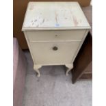 A PAINTED BEDSIDE CABINET WITH ONE DOOR AND ONE DRAWER