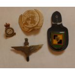 A BAG OF ASSORTED MILITARY BADGES