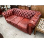 A RED LEATHER BUTTON BACK CHESTERFIELD SOFA