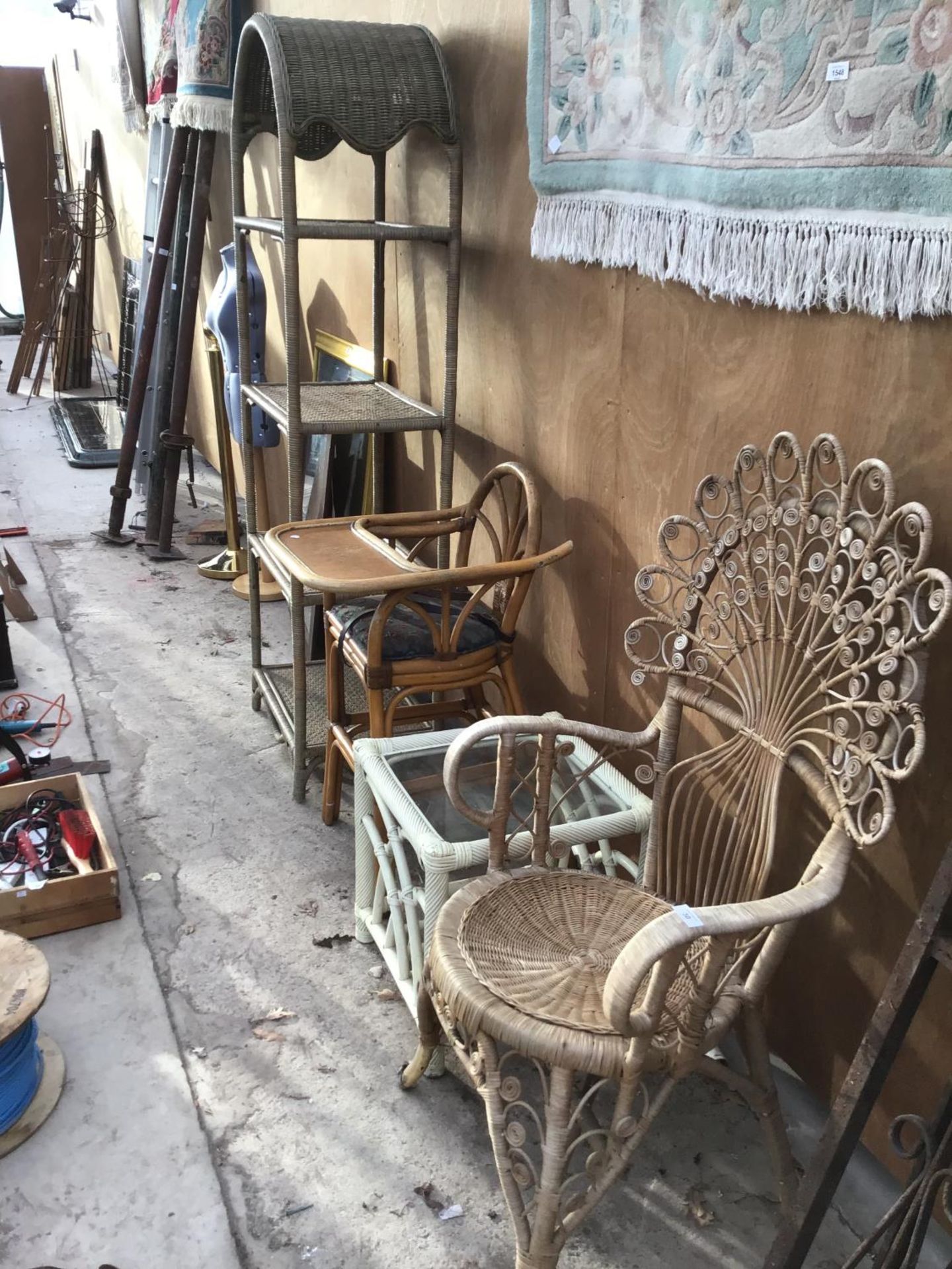 FOUR VARIOUS WICKER ITEMS TO INCLUDE AN ORNATE PEACOCK STYLE BACKED CHAIR, A GLASS TOPPED TABLE,