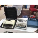 TWO VINTAGE TYPE WRITERS WITH CASES TO NCLUDE AN ADLER JUNIOR 10 AND AN IMPERIAL 200n