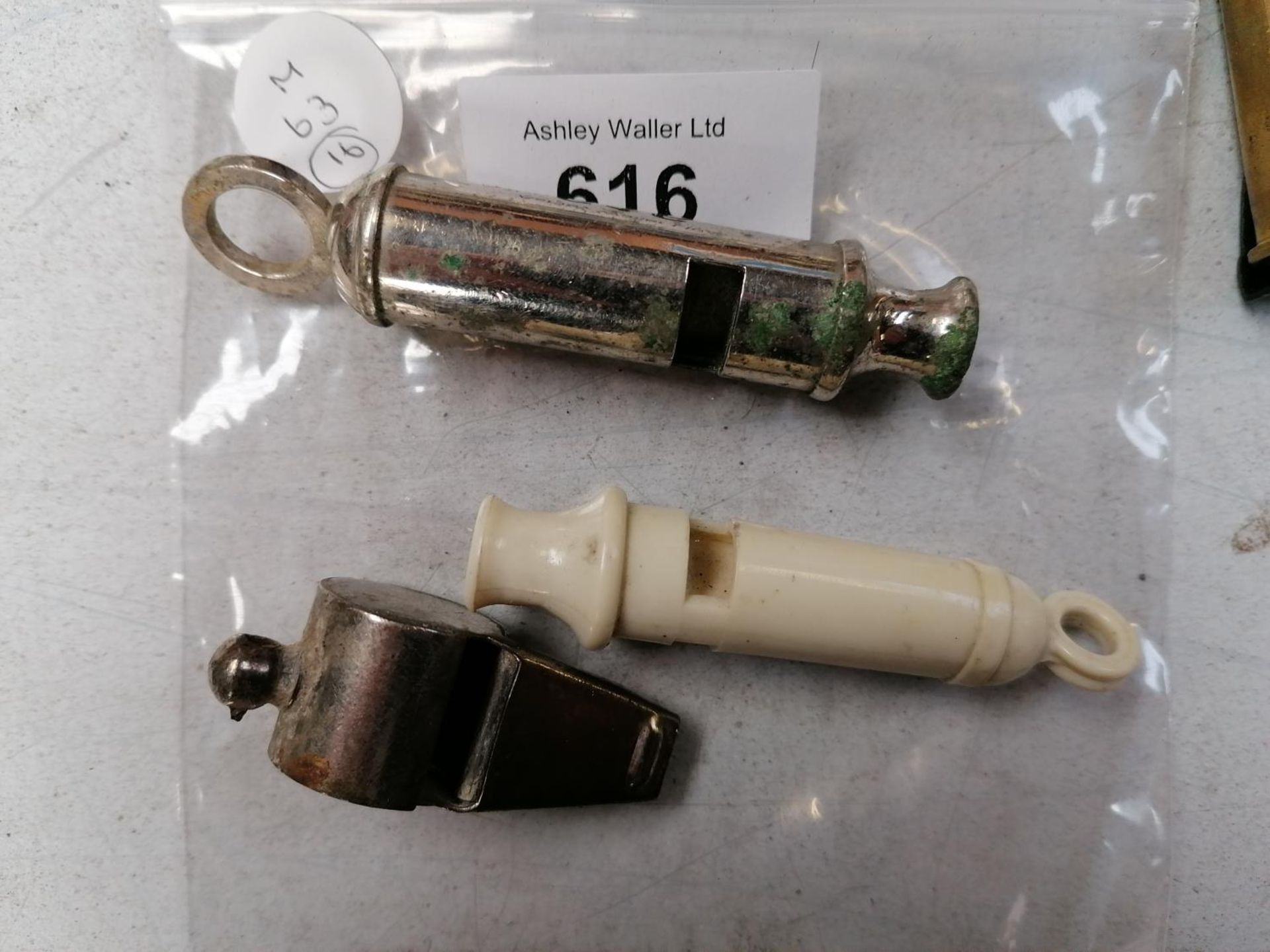 THREE WHISTLES INCLUDING A BRITISH NAVAL WHISTLE ETC