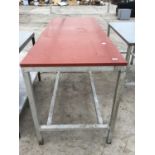 A CATERING TABLE ON STAINLESS STEEL FRAME