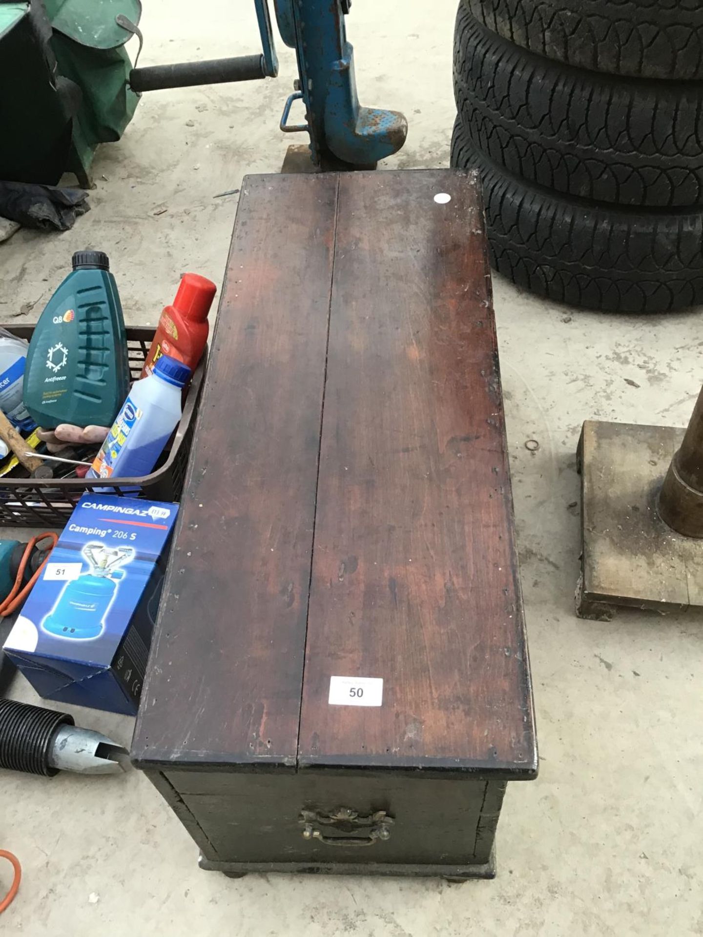 A VINTAGE WOODEN CHEST WITH SIDE HANDLES