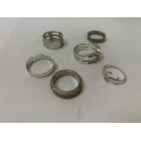 A COLLECTION OF SIX ASSORTED SILVER RINGS