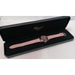 A LADIES BOXED CHOPARD 'FLOATING DIAMONDS' WATCH WITH DIAMONDS AND RUBIES WITH CERTIFICATE FROM
