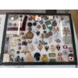 A TRAY OF ASSORTED MILITARY CAP AND FURTHER BADGES