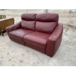 A RED LEATHER TWO SEATER SOFA