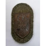 A CHOLM SHIELD BADGE