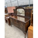 A MAHOGANY MIRROR BACKED SIDEBOARD ON CABRIOLE SUPPORTS WITH TWO DOORS AND THREE DRAWERS