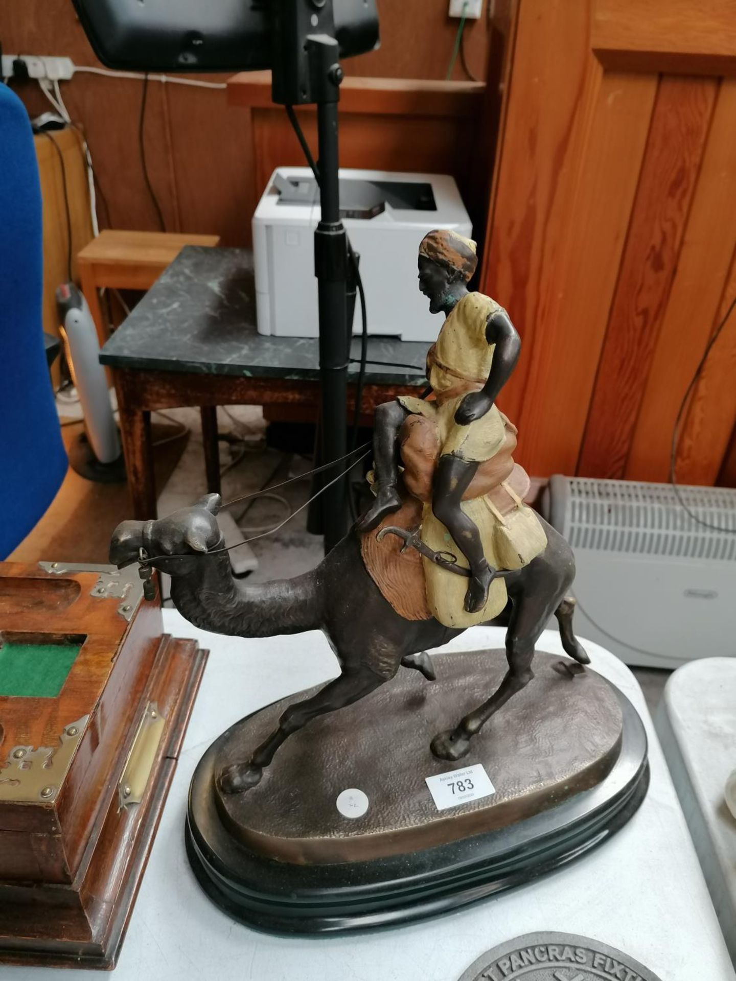 A LARGE BRONZE MODEL OF A CAMEL AND RIDER ON MARBLE BASE