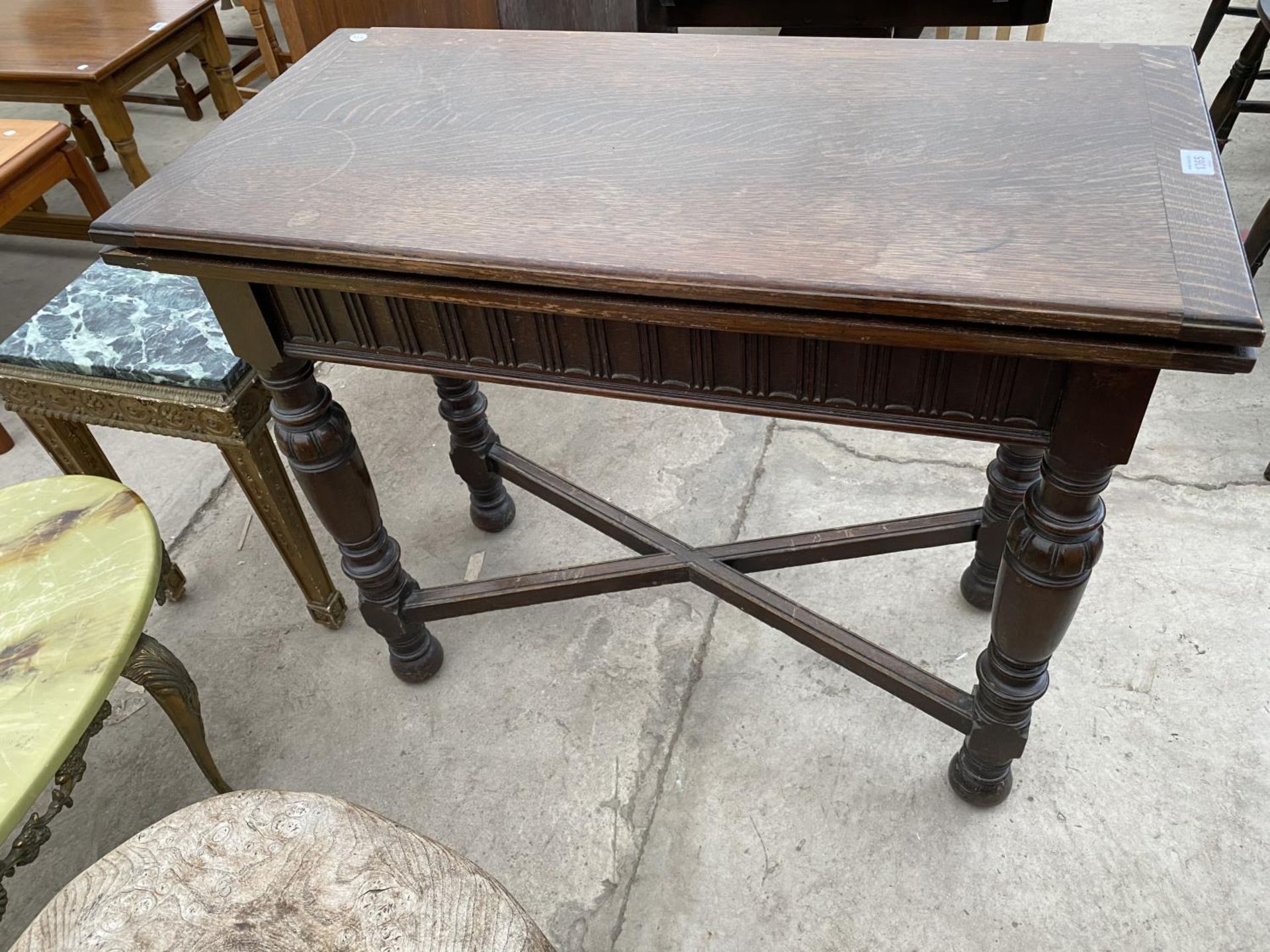 A PRIORY STYLE FOLDING OAK CARD TABLE