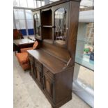 A PRIORY STYLE OAK DRESSER WITH THREE DOORS, THREE DRAWERS AND UPPER PLATE RACK WITH TWO LEAD GLAZED