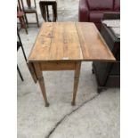 A PINE DROP LEAF KITCHEN TABLE