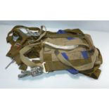 A PARACHUTE HARNESS, DATED 1964