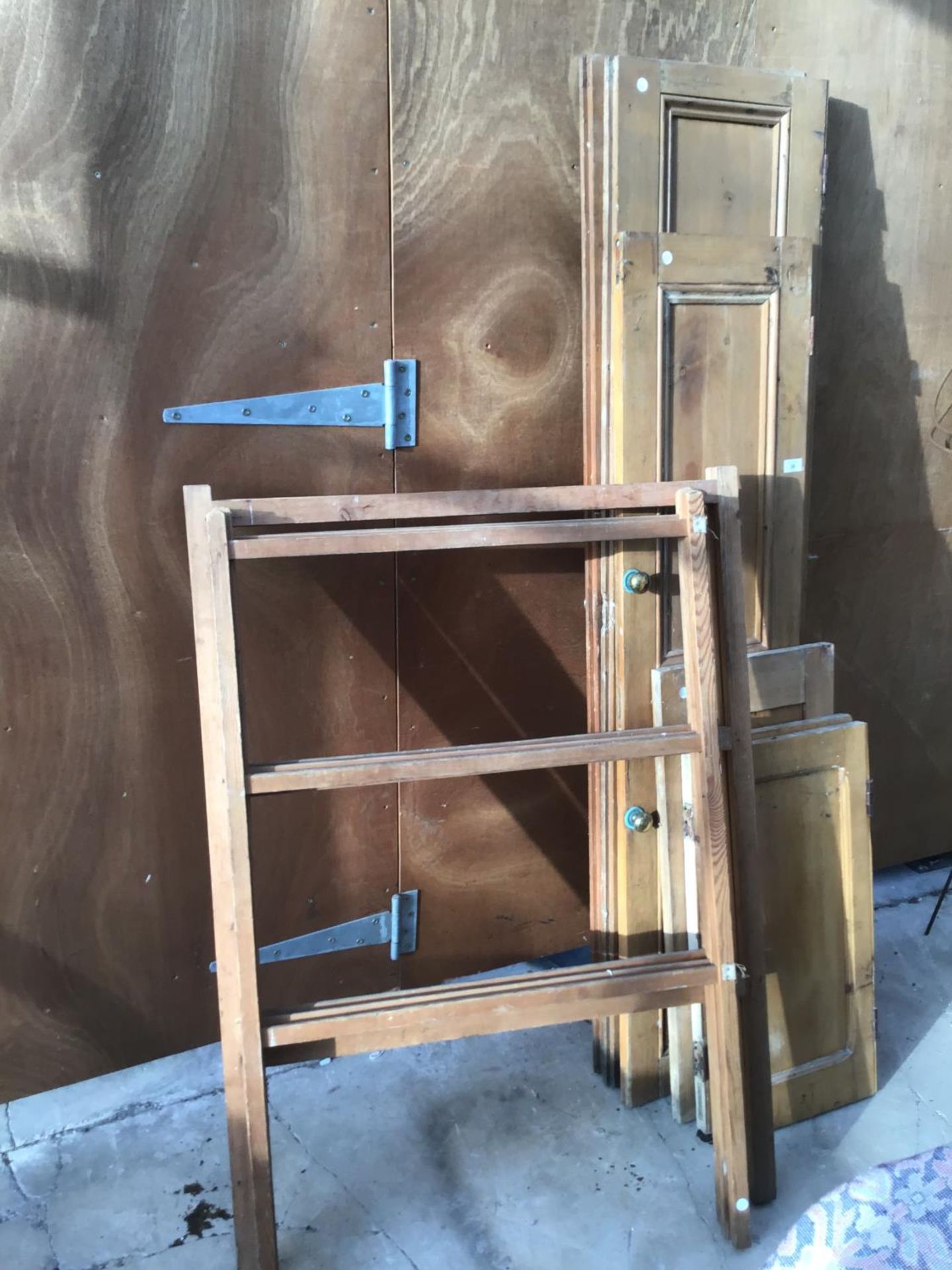 A COLLECTION OF VARIOUS SIZED PINE DOORS AND TWO VINTAGE WOODEN CLOTHES MAIDENS