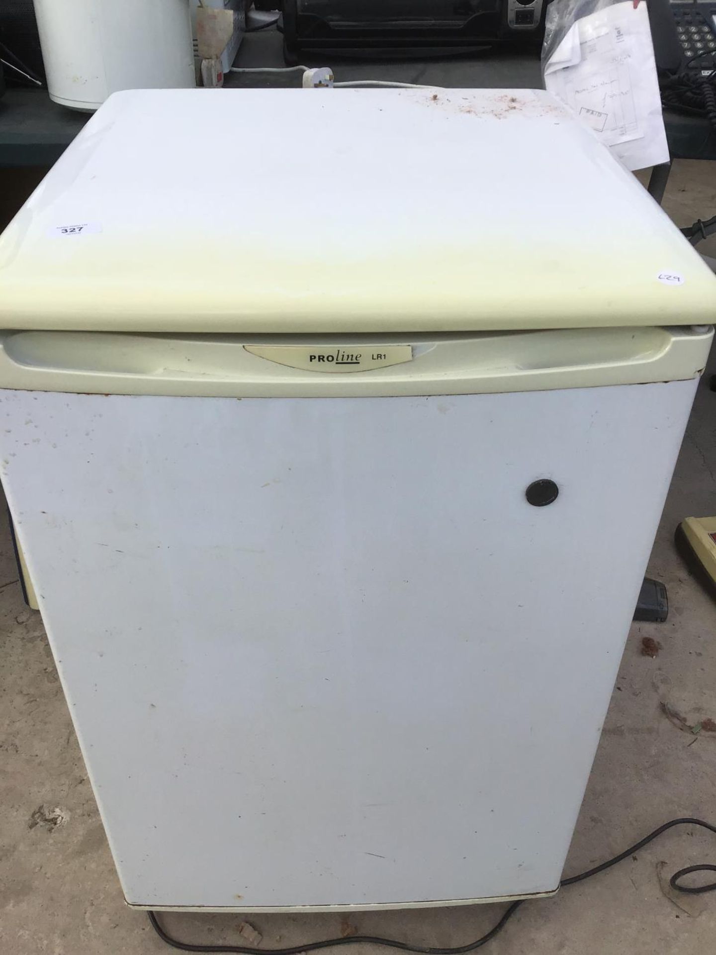 A PROLINE FRIDGE IN NEED OF CLEAN IN WORKING ORDER