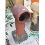 A LARGE RED COLOURED CHIMNEY POT