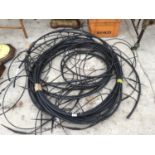 A LARGE QUANTITY OF PLASTIC IRRIGATION PIPING FOR WATERING HANGING BASKETS AND TUBS